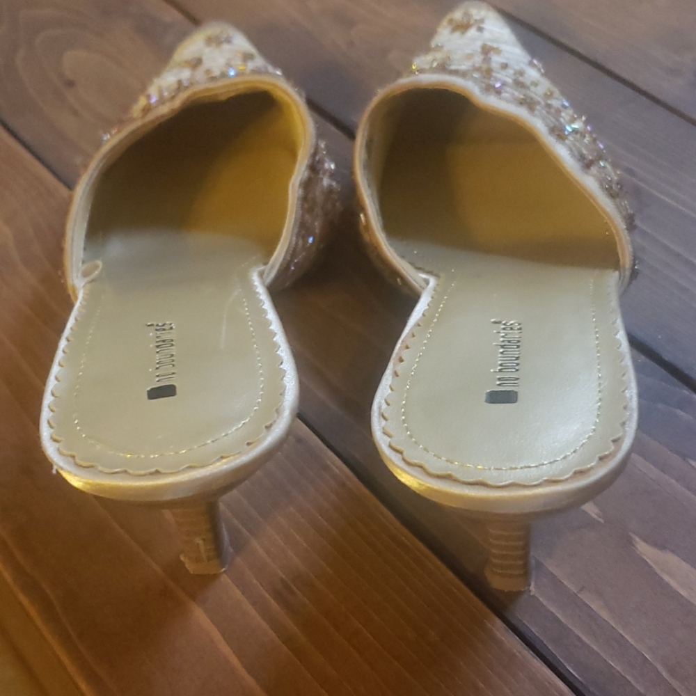 Gold slip on heels.